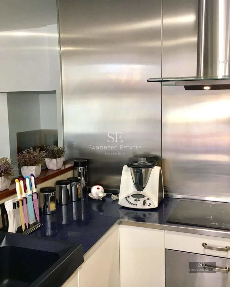 Exterior view of a modern house with pool, wooden terrace, and lush garden. Minimalist design with large windows and natural light.