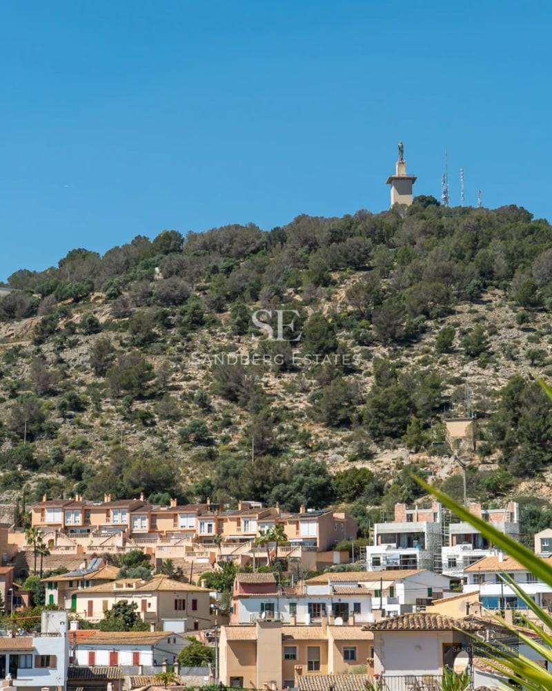 View of a luxurious pool surrounded by modern architecture and lush greenery. Elegant design with ambient lighting.