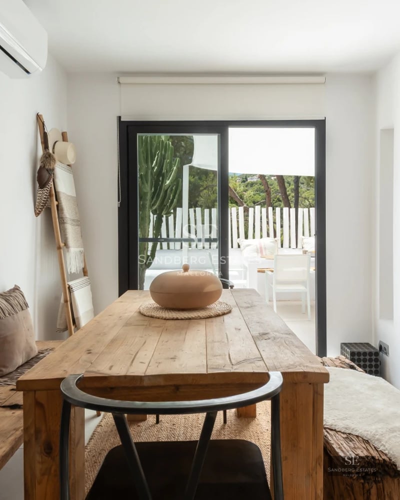 Exterior view of a luxurious villa with a swimming pool, modern architecture, large windows, and lush greenery. Minimalist design.