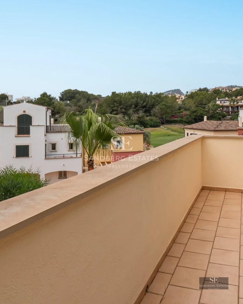 Exterior view of a modern villa featuring a pool, terrace, and spacious garden. Minimalist design with clean lines and large windows.