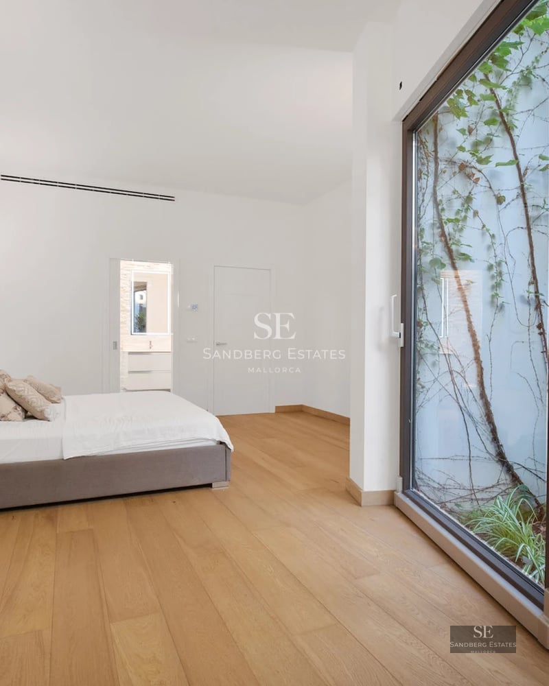 Spacious terrace with infinity pool and sea view. Modern design with elegant outdoor furniture. Soft ambient lighting.