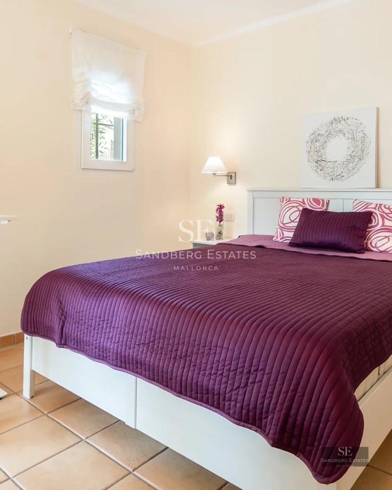 Spacious living room featuring panoramic windows, designer furniture, light wood flooring and stunning Mediterranean sea views.