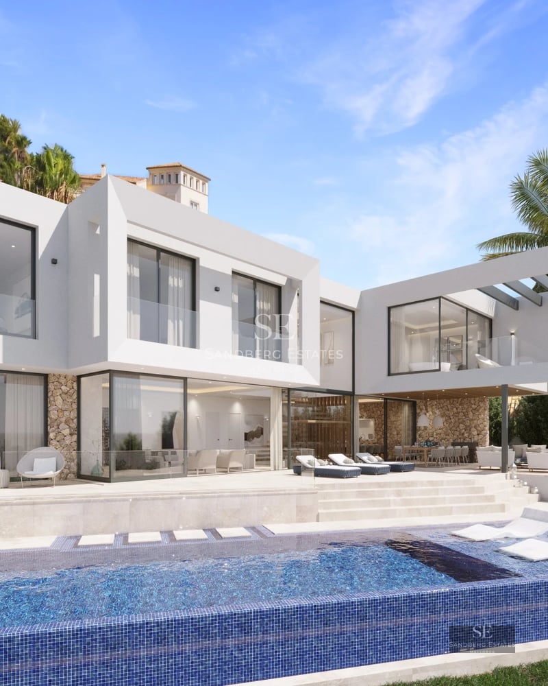 Spacious balcony with panoramic sea view. Modern design with glass railing and stylish furniture.