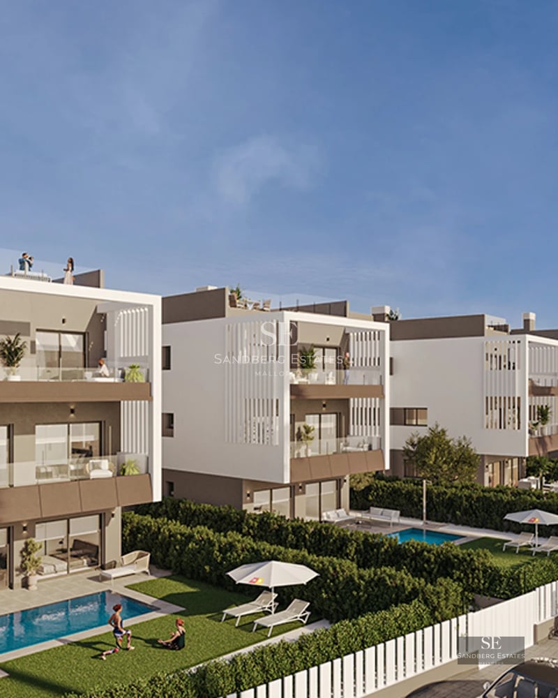 Bright living room with large windows, modern fireplace, and designer furniture. Light wood floors and minimalist decoration.