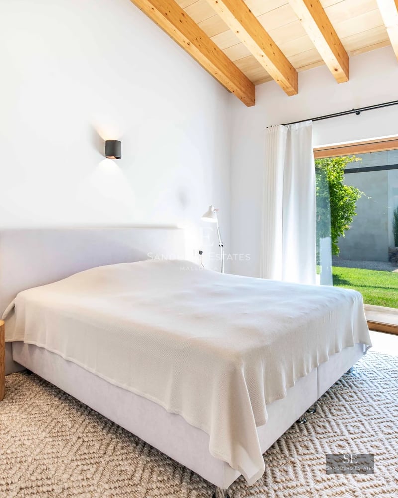 Pool view illuminated at dusk. Modern architecture, clean lines, reflective pool, soft lighting, luxury and comfort.