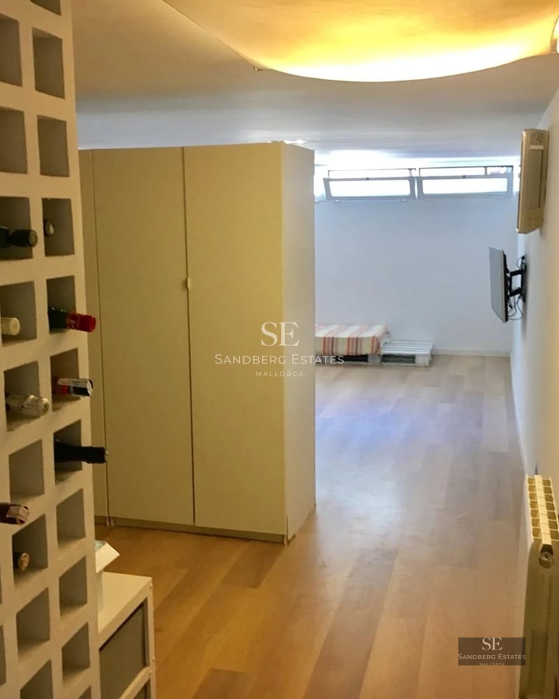 Spacious terrace featuring an infinity pool and ocean views. Minimalist design, modern furniture, and lush vegetation.