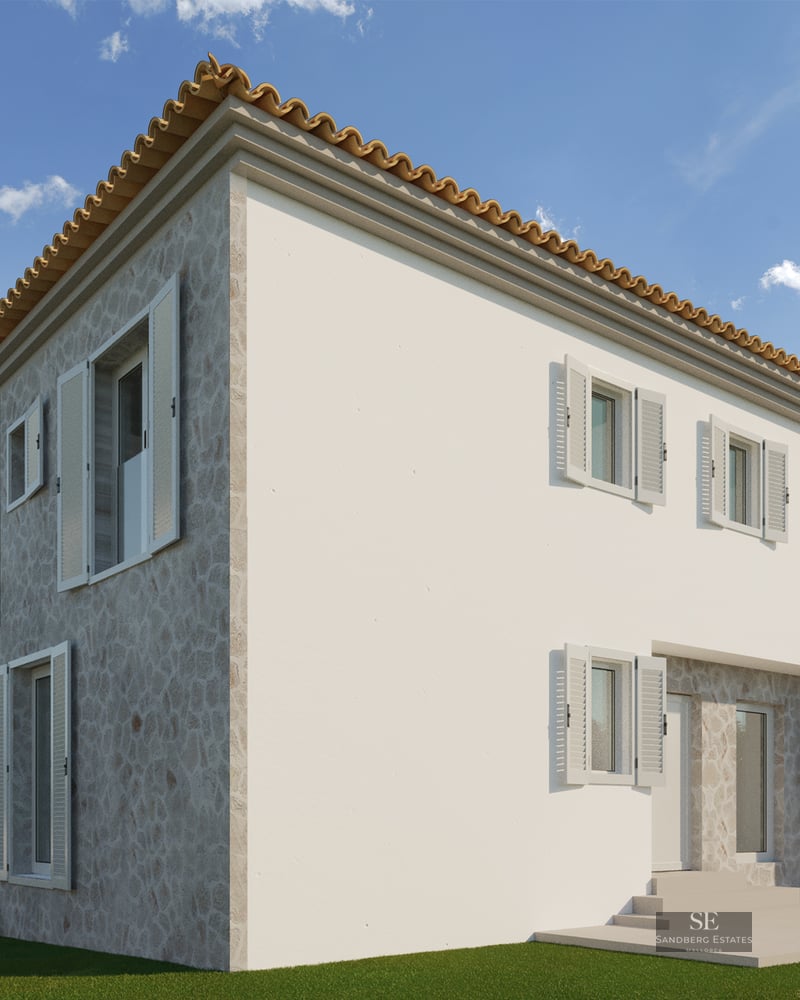 Exterior of a two-story house featuring natural stone facade, white walls, terracotta tile roof, and white shutters.