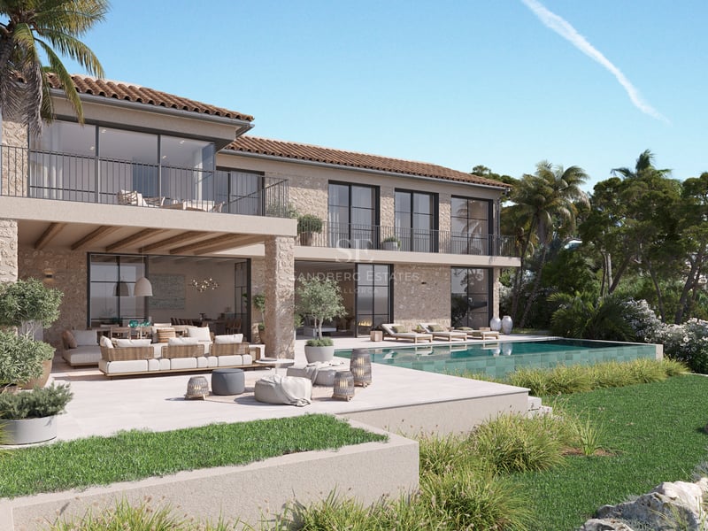 Villa contemporaine de deux étages avec façade en pierre naturelle, piscine et salon extérieur sous un ciel bleu.