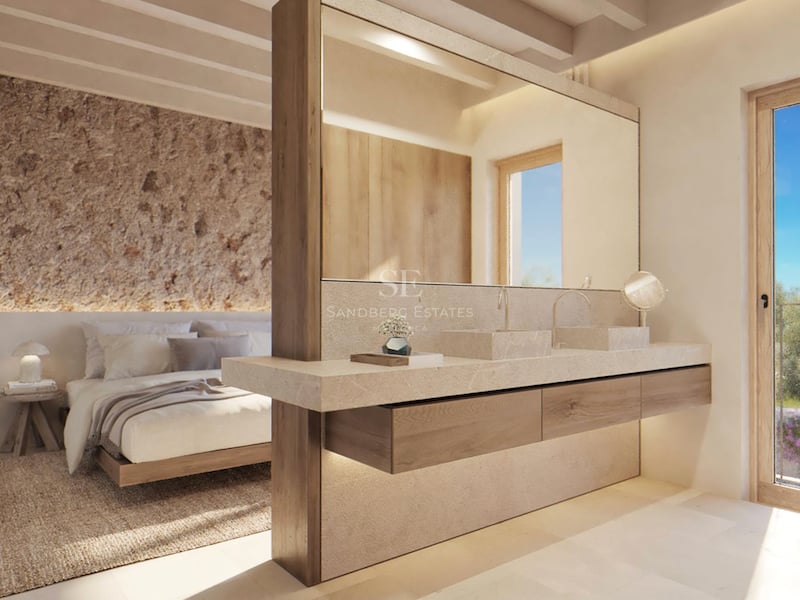 Chambre de maître moderne avec double vasque en pierre intégrée, mur en pierre rustique et plafond à poutres.