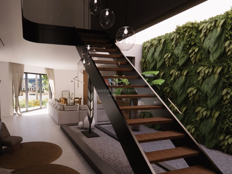 Intérieur moderne avec un escalier en métal noir et marches en bois à côté d'un mur végétal luxuriant.