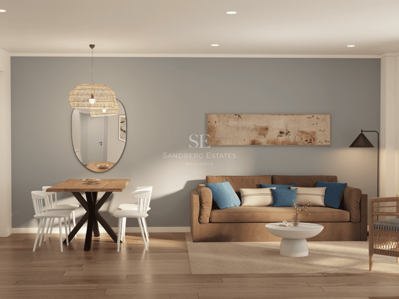 Salon moderne avec canapé marron, coussins bleus, table à manger en bois et fauteuil en osier sur parquet.