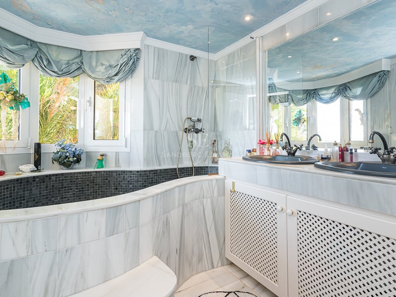 Spacious terrace with infinity pool and panoramic views. Modern design featuring natural stone, wood, and high-end finishes.