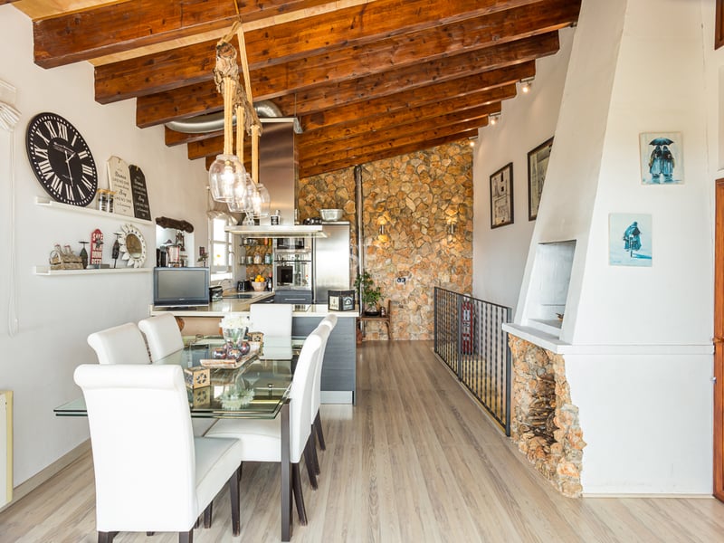 Exterior of modern villa featuring an infinity pool, lush gardens, and expansive terraces. Minimalist architectural design with large windows.