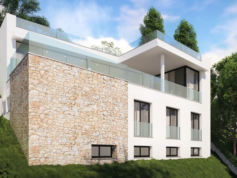 Villa blanche moderne sur une colline verdoyante avec mur en pierre naturelle et garde-corps en verre.