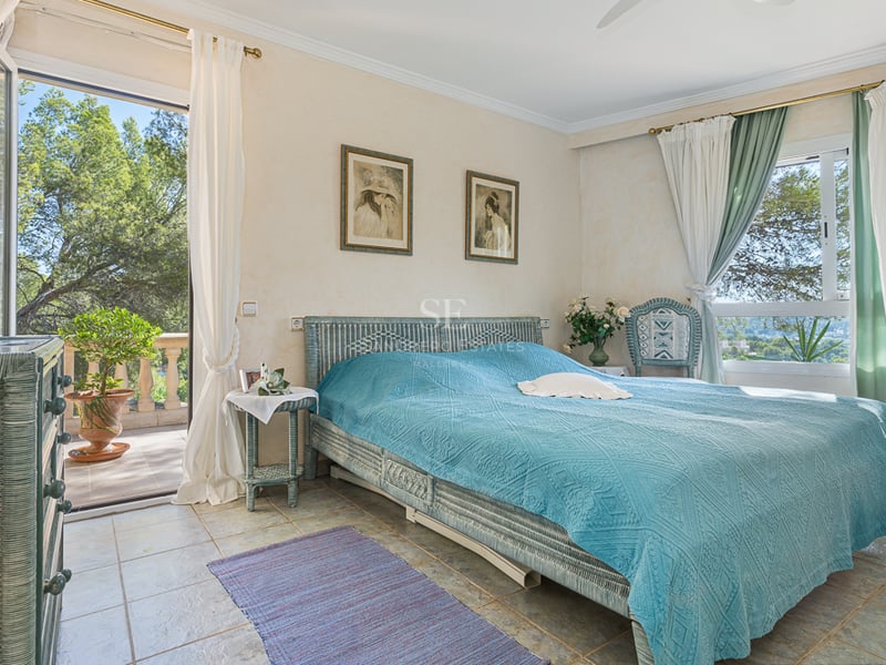 Spacious living room with panoramic windows, abundant natural light, and modern furnishings. Breathtaking sea views. Contemporary design.