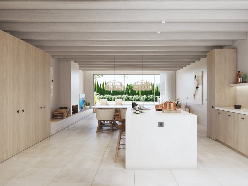 Cuisine contemporaine avec menuiserie en bois clair, îlot blanc et poutres au plafond s'ouvrant sur le jardin.