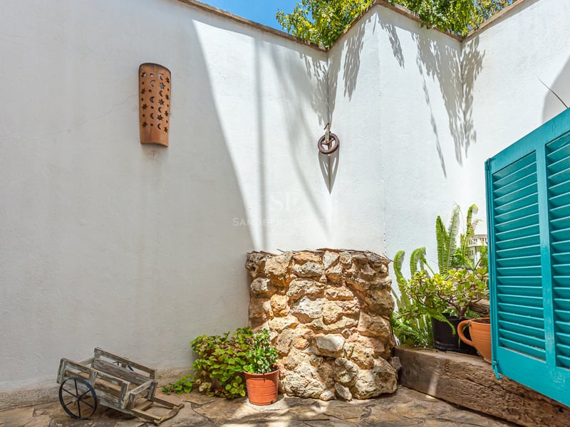 Exterior view of a modern villa with a pool, lush garden, and large windows. Minimalist architecture and high-quality finishes.