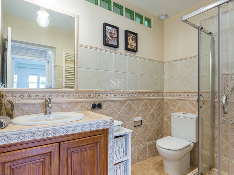 Exterior view of a modern villa featuring a pool, garden, and minimalist architectural design. Large windows and high-quality materials.