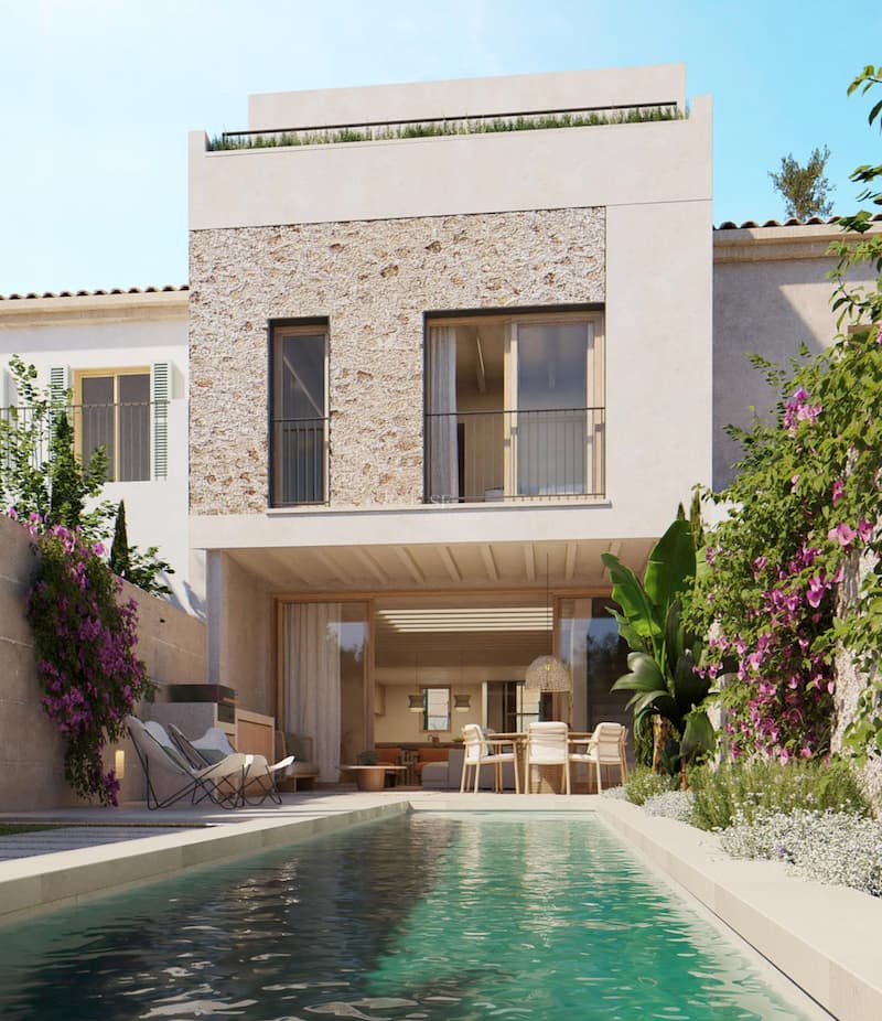 Piscine allongée devant une villa blanche moderne avec façade en pierre naturelle et bougainvilliers.