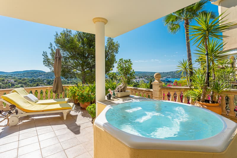 Exterior view of modern villa with infinity pool, lush garden, and expansive terraces. Minimalist architecture and elegant design.