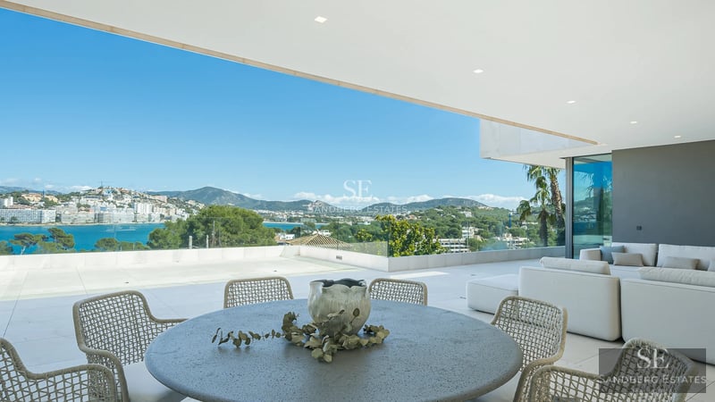 Exterior view of a modern house with a pool, large garden, terraces, and panoramic windows. Minimalist architectural design.