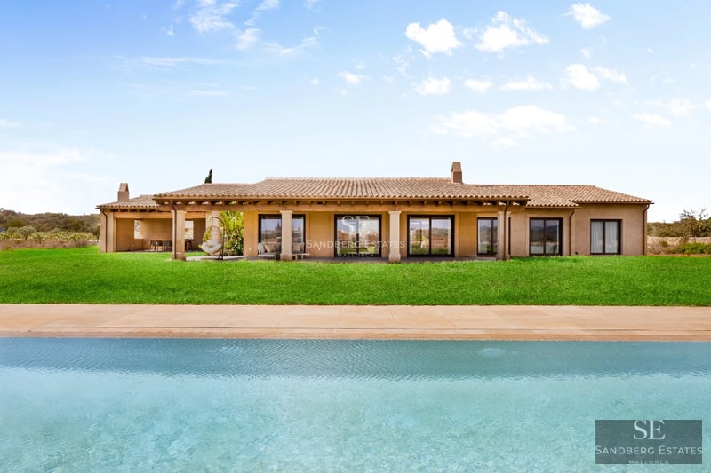 Modern pool view with sleek furniture and lush gardens. Minimalist architecture with large windows and natural lighting.