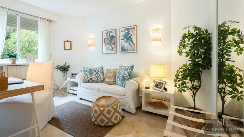 Spacious terrace with panoramic views. Modern outdoor furniture, awning, and lush greenery. Warm lighting and a relaxing atmosphere.