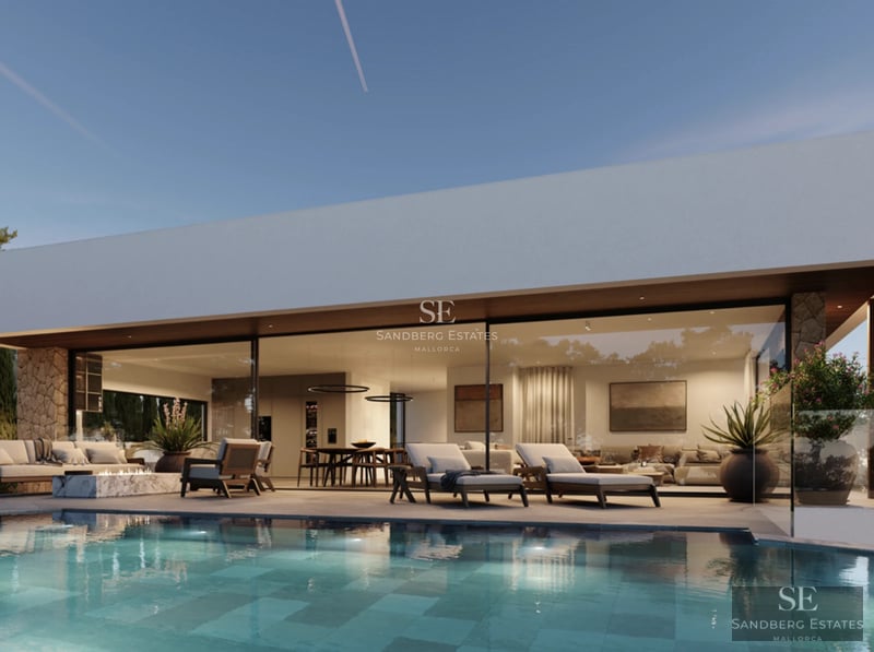 Spacious living room featuring large windows, designer sofas, modern coffee table and access to a terrace with a pool.