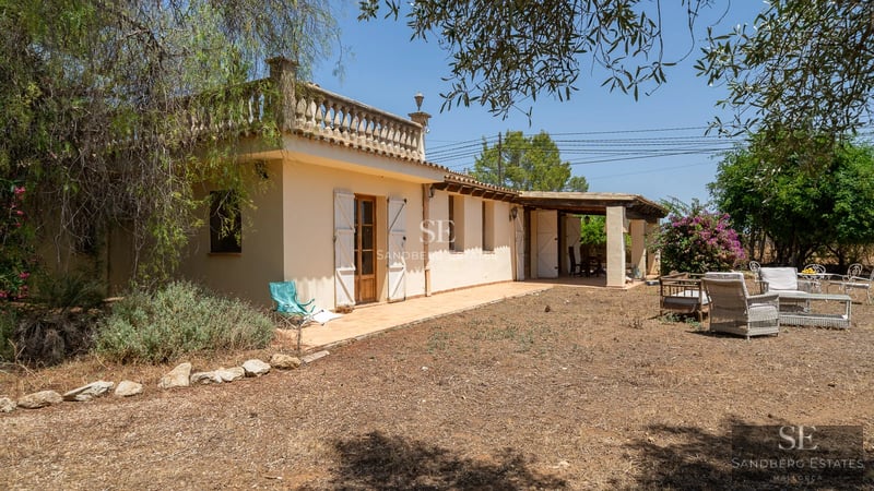 Image of a modern house with a swimming pool, patio, and lush garden. Contemporary architecture and appealing exterior design.