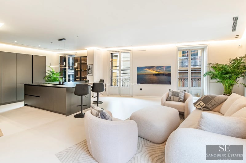 Exterior view of a modern villa with infinity pool, manicured garden, and large windows. Minimalist and elegant architectural design.