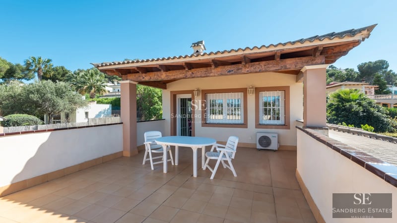 Spacious balcony with ocean views, modern outdoor furniture, and tiled flooring. Sleek and bright design.