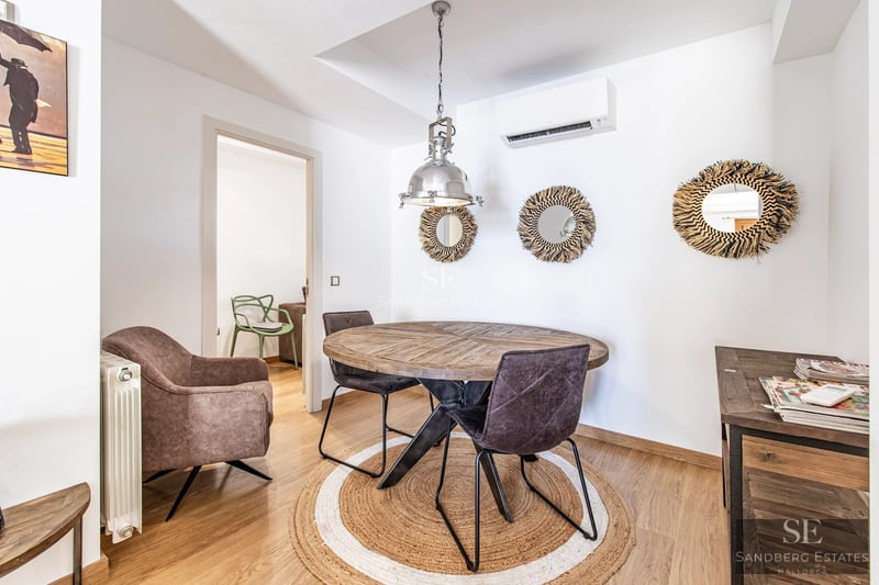 Wide view of a luxurious terrace with pool, sun loungers, and lush vegetation. Modern and elegant design with high-quality finishes.