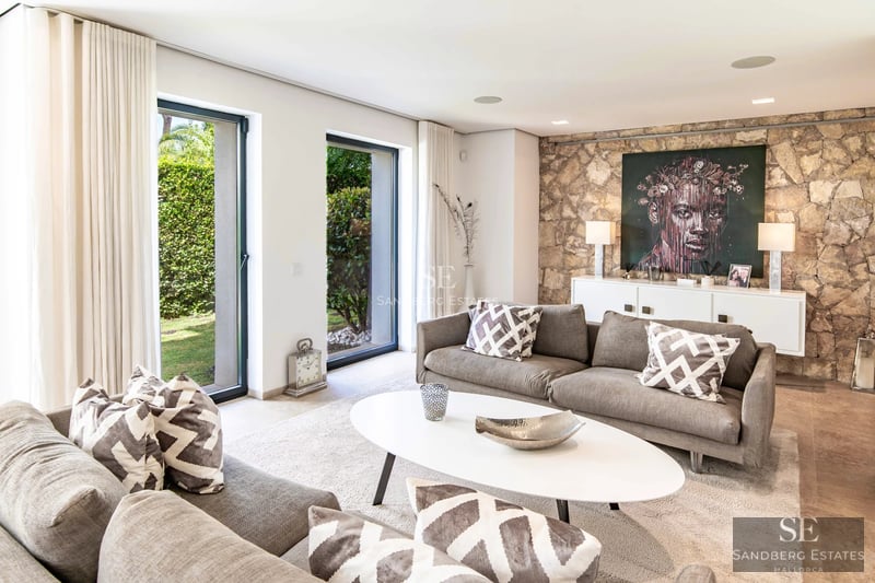 Spacious terrace with infinity pool, sun loungers, and panoramic views. Modern design with clean lines and high-quality materials.