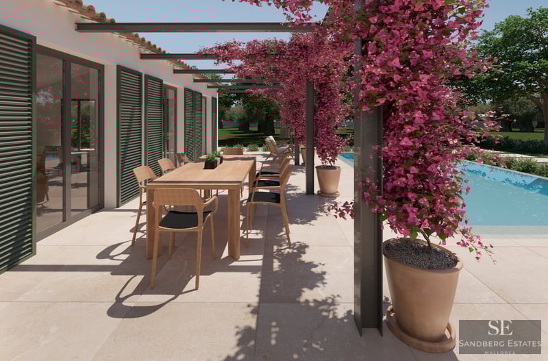 A sun-drenched outdoor terrace with a wooden dining table, pink bougainvillea climbing a pergola, and a turquoise pool.