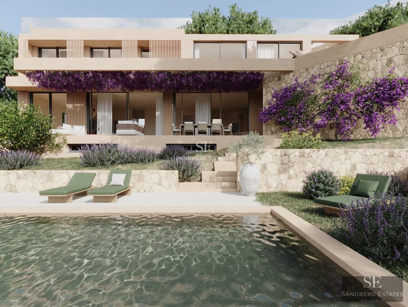 Spacious living room featuring large windows, modern sofas, and access to a terrace with views. Elegant and bright design.