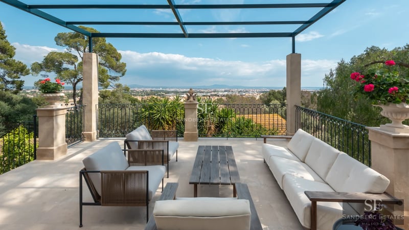 View of an infinity pool surrounded by lush greenery and modern architecture. Minimalist and elegant design with soft lighting.