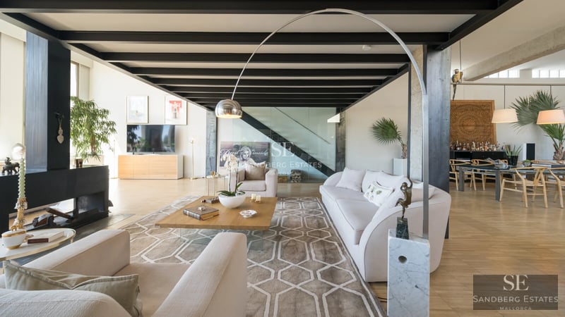 Spacious exterior with pool, lounge chairs, umbrellas, lawn, and plants. Modern and elegant design. Soft ambient lighting.