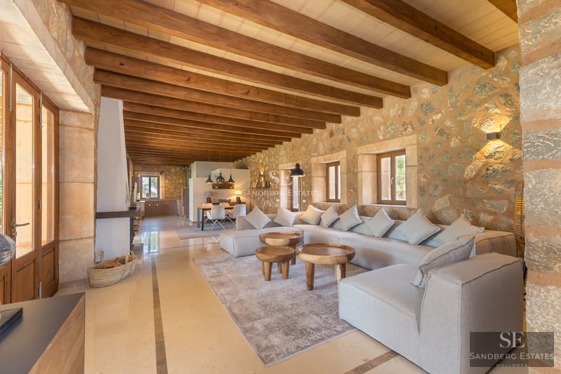 Expansive terrace featuring an infinity pool, sun loungers, and panoramic views. Modern, minimalist design with touches of greenery.