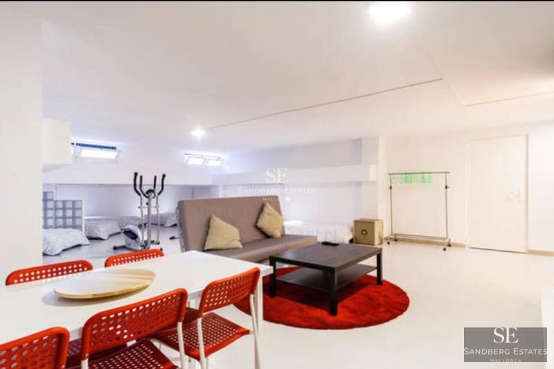 Exterior view of a modern villa featuring a pool, large windows, and lush landscaping. Minimalist architecture and open spaces.