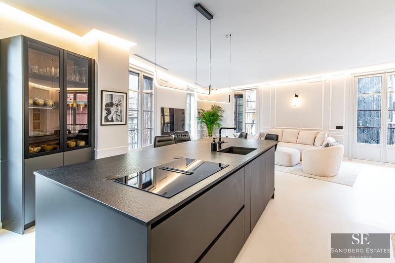 Exterior of a modern villa featuring an infinity pool, manicured garden, and minimalist architecture. Soft evening light.