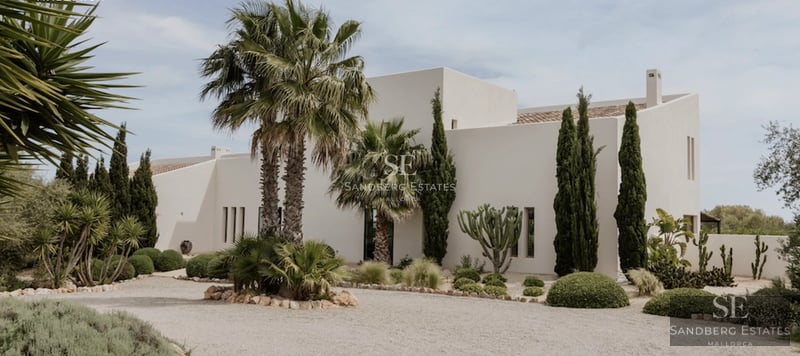 Spacious balcony with sea view. Modern outdoor furniture, wooden floor. Bright and elegant space.