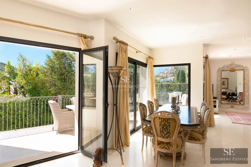 View of a modern house with an infinity pool and spacious terraces. Contemporary architecture and panoramic views.