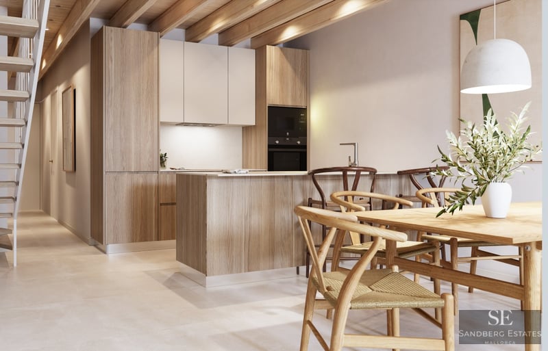 Modern kitchen featuring exposed wooden ceiling beams, a central island with stools, and an adjacent wooden dining table.