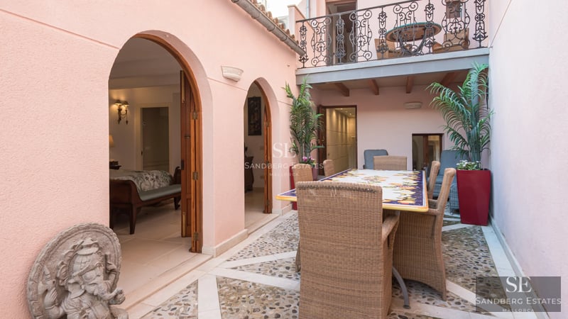 Exterior view of a modern villa with pool, minimalist architecture, large windows and elegant landscaping.
