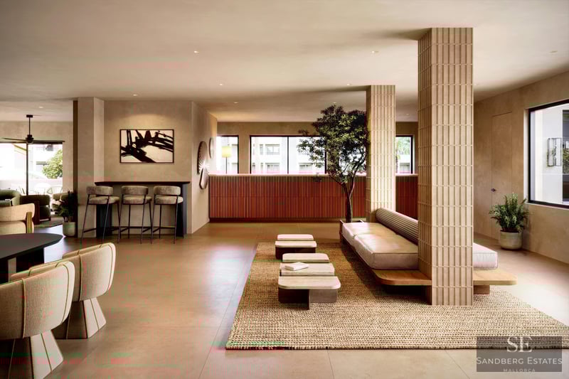 Modern lobby with fluted columns, low seating, a woven rug, and warm terracotta accents in a minimalist setting.