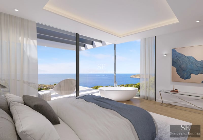 Spacious balcony with ocean view. Modern design, glass railing. Ideal for relaxing and enjoying the seascape.