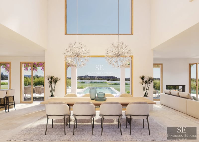 Spacious living room with large windows overlooking a modern pool. Designer sofas and abundant natural light.