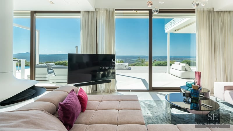 Spacious terrace with infinity pool, sun loungers, and panoramic views. Modern, elegant, and minimalist design. High-quality outdoor furniture.