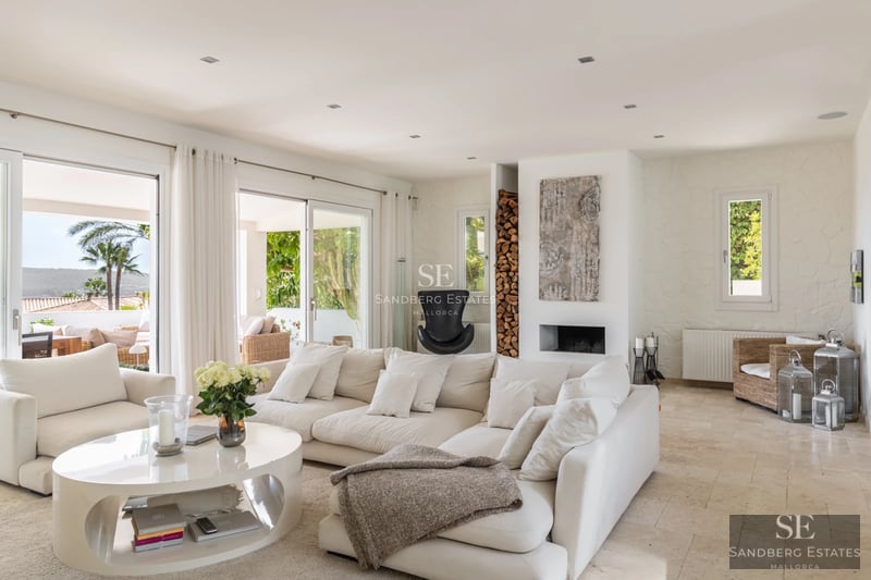 Spacious balcony with panoramic sea views. Modern design, glass railing, and elegant outdoor furniture.