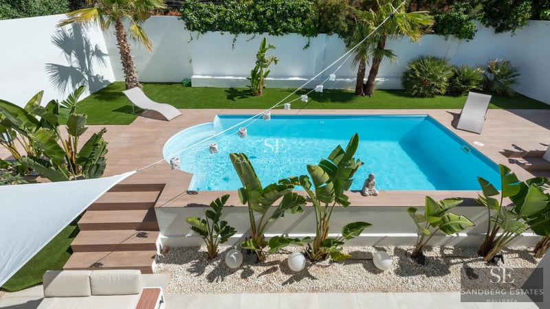 Spacious terrace with infinity pool, ocean view, and modern furniture. Minimalist design with high-quality finishes.